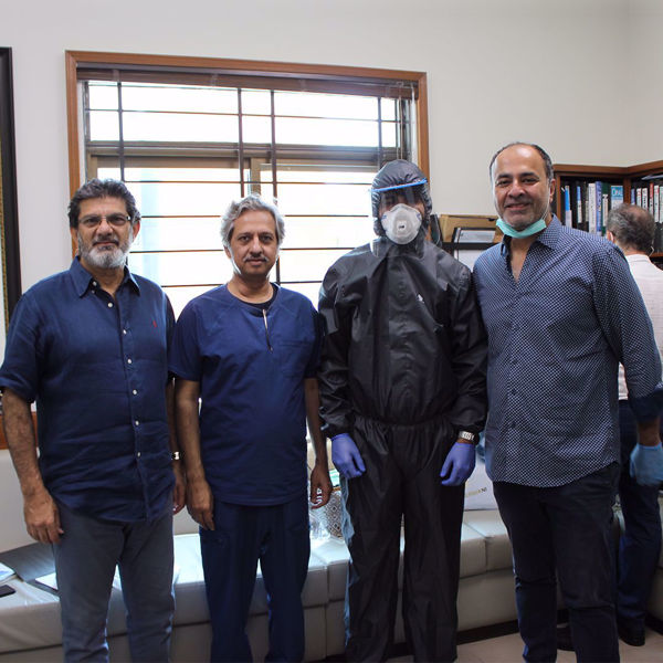 Picture of Deepak Perwani at the Patient Aid Foundation, Donating the reusable, water and air proof PPE suits to healthcare staff.